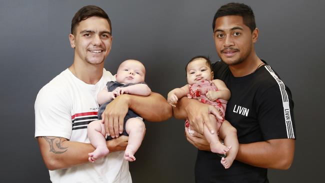 Anthony Milford with daughter Ariana, and Kodi Nikorima with son Zavier. (AAP Image/Claudia Baxter)