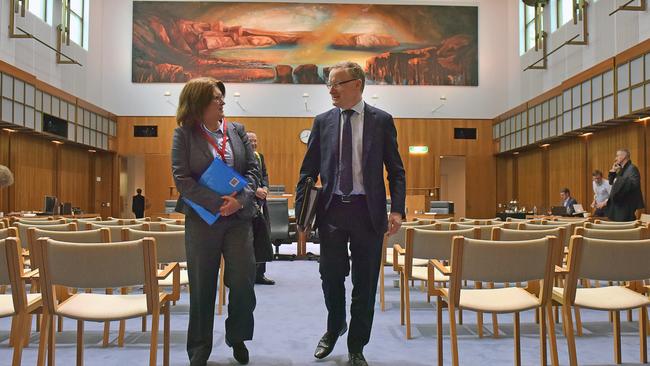 Philip Lowe, outgoing governor of the RBA, right, and Michelle Bullock, leave a House of Representatives economics committee in Canberra. Photographer: Mark Graham/Bloomberg