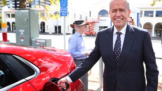 Bill Shorten charges an electric car at the launch of Labor's Climate Change Action Plan in Canberra. Picture: Kym Smith