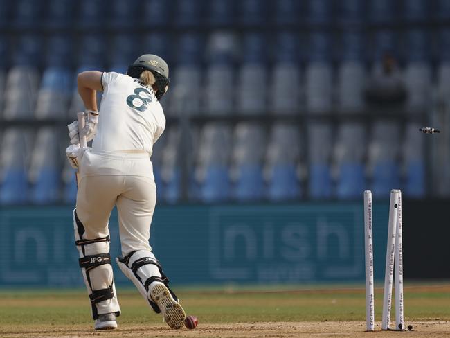 MUMBAI, INDIA - DECEMBER 21: Ellyse Perry of Australia is bowled out by Pooja Vastrakar of India during day one of the Women's Test Match between India and Australia at Wankhede Stadium on December 21, 2023 in Mumbai, India. (Photo by Pankaj Nangia/Getty Images)