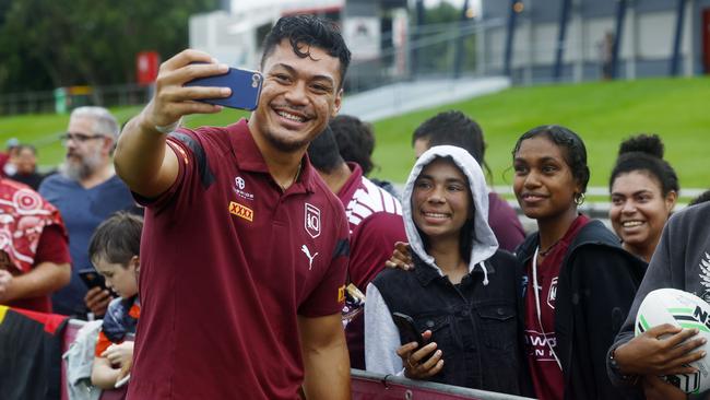 State of Origin player Jeremiah Nanai takes a selfie for Katherine Mara and Fanny Tamwoy at the Queensland Maroons fan day, a meet the players session at Barlow Park. Picture: Brendan Radke