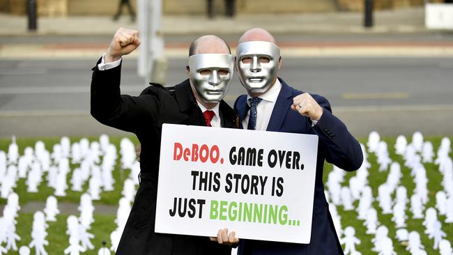 Masked brothers A and B outside the Supreme Court after paedophile Vivan Deboo, who sexually assaulted them three decades ago, lost his appeal to serve his sentence in the comfort of his own home. Picture: AAP / Sam Wundke