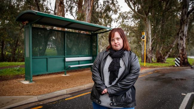 Sarah Byrne at her bus stop in Redwood Park. Ms Bynre says it has been difficult to work out what the changes will mean for her. Photo: MATT TURNER.