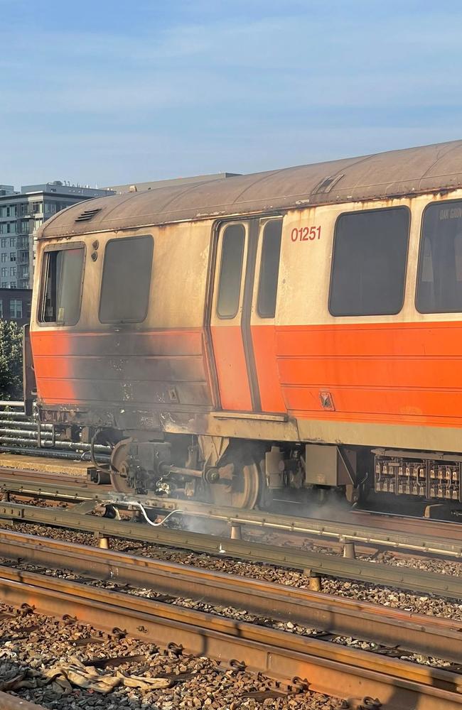 The Orange Line train was travelling over the Mystic River when it burst into flames. Picture: @PJayG/Twitter