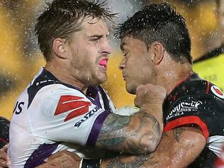 Cameron Munster of the Storm (left) and Issac Luke of the Warriors clash during the Round 2 NRL match between the New Zealand Warriors and the Melbourne Storm at Mount Smart Stadium in Auckland, New Zealand, Friday, March 10, 2017. (AAP Image/David Rowland) NO ARCHIVING, EDITORIAL USE ONLY