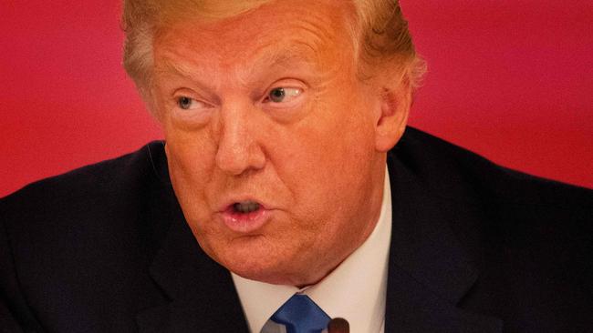 US President Donald Trump participates in a roundtable with stakeholders positively impacted by law enforcement, in the East Room of the White House in Washington, DC, on July 13, 2020. (Photo by JIM WATSON / AFP)