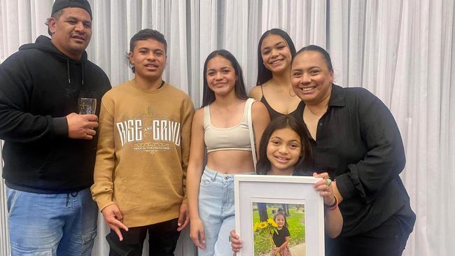 Vogue’s loved ones pictured with a framed photo of Vogue. Picture: Facebook