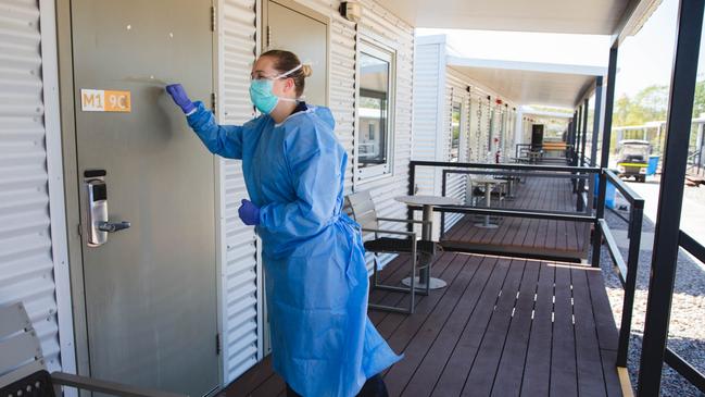 An NT Health worker checking in on a Howard Springs Quarantine Facility resident. Picture: Suppled/ NT Health