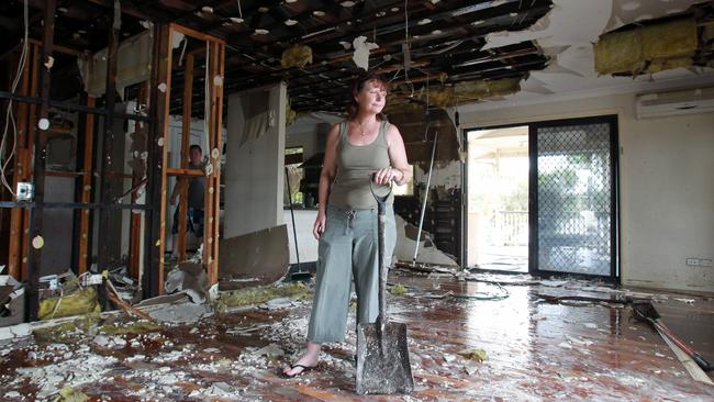 Janet Roussounis in her home destroyed by flooding in Ipswich in 2011. Picture: Adam Smith