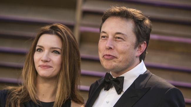 (FILES) This file photo taken on March 2, 2014 shows CEO of SpaceX and Tesla Elon Musk and wife Talulah Riley as they arrive at the 2014 Vanity Fair Oscar Party on in West Hollywood, California. Entrepreneur Elon Musk and his British actress wife Talulah Riley are to end their marriage for a second time, official sources told AFP on March 21, 2016. The couple wed in 2010 and remarried in 2013 after a their first divorce, but Riley filed for divorce again in Los Angeles Superior Court on Monday.  / AFP PHOTO / ADRIAN SANCHEZ-GONZALEZ