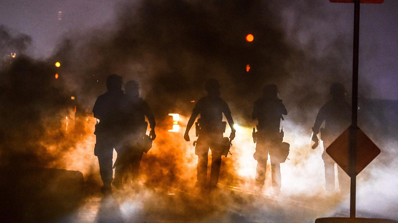 Police fire tear gas canisters at protesters in the city. Picture: Chandan Khanna / AFP