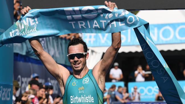 Jake Birtwhistle crosses the line to win the elite male race at the 2019 Noosa Triathlon. Picture: Warren Lynam