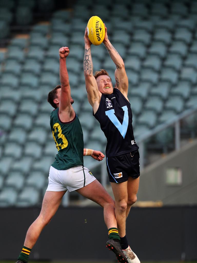 Vic Metro Jhye Baddeley- Kelly marks during the game against Tasmania at UTAS Stadium. PICTURE CHRIS KIDD