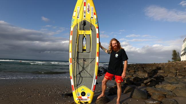 Charity paddle-boarder Ben Ferris pictured at Burleigh Heads. Photograph : Jason O'Brien