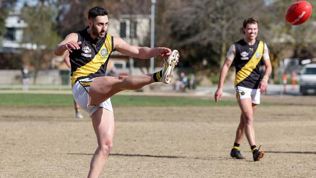 Jake Parente of Mitcham kicks a goal. Picture: George Salpigtidis