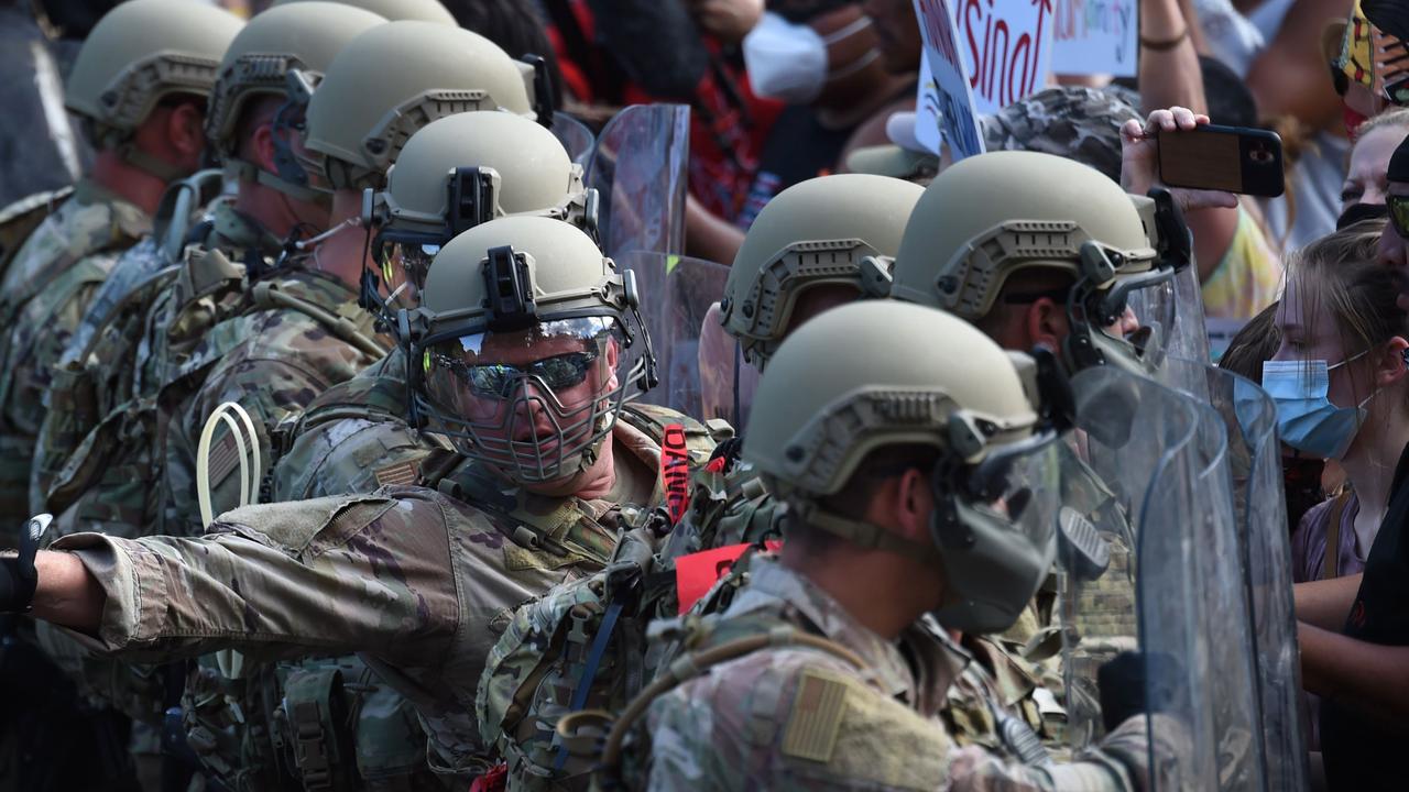 Activists blocked the road to Mount Rushmore National Monument before Mr Trump’s scheduled appearance on Friday. Picture: Andrew Caballero-Reynolds / AFP