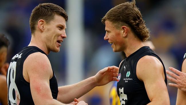 PERTH, AUSTRALIA - AUGUST 18: Sam Walsh of the Blues and Cooper Lord of the Blues congratulate each other after the win during the round 23 AFL match between West Coast Eagles and Carlton Blues at Optus Stadium, on August 18, 2024, in Perth, Australia. (Photo by James Worsfold/Getty Images)