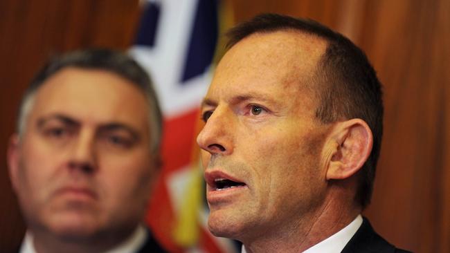 TO GO WITH Australia-vote-Abbott PROFILE by Madeleine Coorey (FILES) In a file picture taken on June 2, 2010 Australian opposition leader Tony Abbott (R), with Shadow Treasuer Joe Hockey (L), speaks at a press conference in Sydney. Australia's Speedos-loving, gaffe-prone conservative leader Tony Abbott may be known as the |Mad Monk|, but his earthy personality may see the one-time trainee priest win power. Abbott, a Catholic, monarchist family man, faces off against the Labor Party's unwed, childless, atheist, career woman Prime Minister Julia Gillard in national elections on August 21. AFP PHOTO/FILES/Greg WOOD