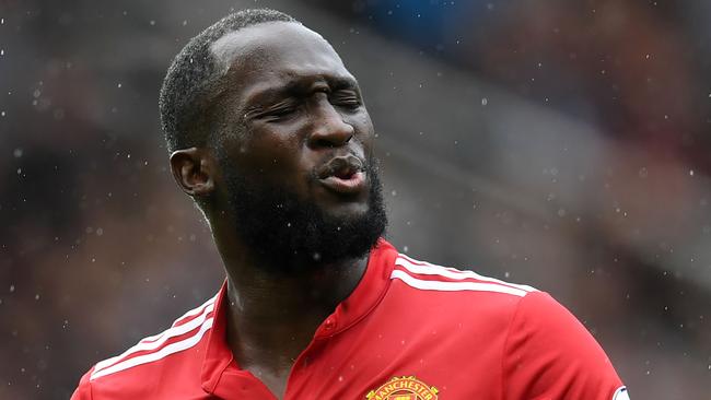 Manchester United's Belgian striker Romelu Lukaku reacts to a missed oppurtunity during the English Premier League football match between Manchester United and Crystal Palace at Old Trafford in Manchester, north west England, on September 30, 2017. / AFP PHOTO / Paul ELLIS / RESTRICTED TO EDITORIAL USE. No use with unauthorized audio, video, data, fixture lists, club/league logos or 'live' services. Online in-match use limited to 75 images, no video emulation. No use in betting, games or single club/league/player publications.  /