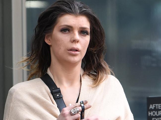 Jonita Ragaisyte leaves the County Court of Victoria in Melbourne, Friday, September 20, 2019. Jonita Ragaisyte, 27, pleaded guilty to two charges of possessing a drug of dependence earlier this week, more than two years after police raided the Docklands apartment she shared with then boyfriend Cemre Volkan. (AAP Image/Julian Smith) NO ARCHIVING