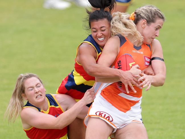 ADELAIDE, AUSTRALIA - JANUARY 17: Hannah Button of the Adelaide Crows tackles during the AFLW pre-season match between the Adelaide Crows and the GWS Giants at Norwood Oval on January 17, 2021 in Adelaide, Australia. (Photo by Daniel Kalisz/Getty Images)