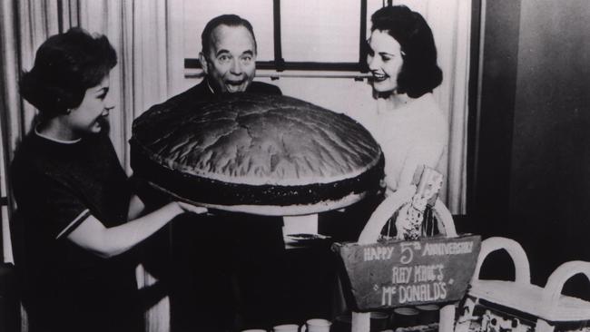 McDonald's founder Ray Kroc with a giant hamburger.