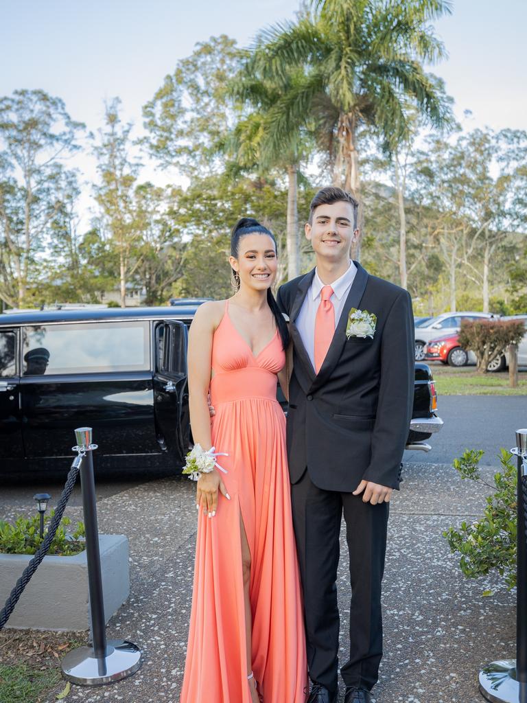 Glasshouse Christian College students Felicity Agius and Patrick Mackie arrive in style in a black stretch limousine complete with chauffeur in full livery and cap. Picture: Jordan Bull