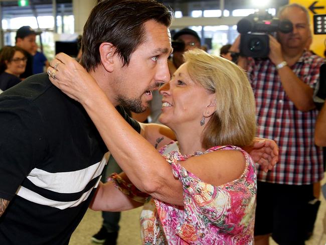 Pearce greeted by his mother Terri at Sydney airport after returning from his stint in rehabilitation. Picture: Gregg Porteous