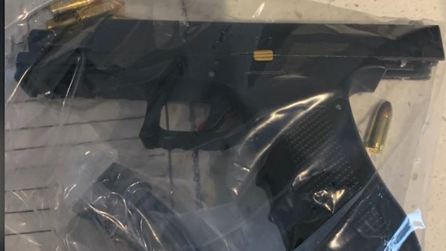 A hand gun found during a raid of a Paradise Point home.