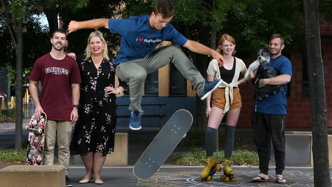 Bronson Culpin-Lavers, Katrine Hildyard, Jasmin Hendrie, and George Sarantoulias watch as Finn Owen Pfluger flips his board. They all want a permanent skate park built in the city.