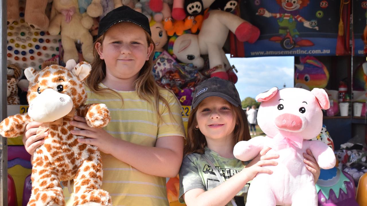 Georgia and Dakota Quinn of Bowen got lucky on the first game they played at the Bowen Show on Tuesday, both winning prizes on the Clowns. Picture: Kirra Grimes