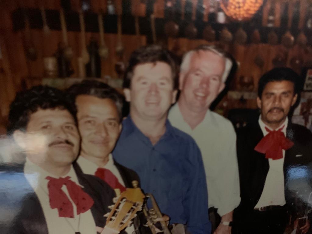 Journalist Steve Barrett, third from left, with former AFP Deputy Commissioner John Lawler, celebrating in Honduras after Barrett helped with the arrest of paedophile Dolly Dunn. Picture: Supplied