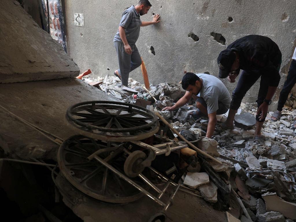 Palestinians check debris after Israeli bombardment in Rafah in the southern Gaza Strip. Picture: AFP