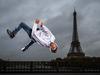 (FILES) In this file photo taken on November 9, 2016 Sofiane, or B-boy Soso, from Melting Force dance crew poses in front of the Eiffel Tower on Bir-Hakeim bridge in Paris. - Breakdancing, surfing, climbing and skateboarding : the Olympic Games Organizing Committee (COJO) for Paris-2024 will unveil on February 21, 2019 a list of "guest sports" for the Paris-2024, which still needs to be validated by the International Olympic Committee (CIO), it was announced on February 20. (Photo by Lionel BONAVENTURE / AFP)