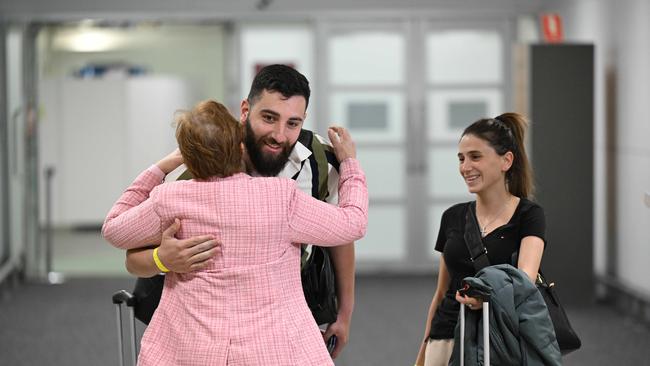 Newlyweds Joseph and Joelle Antoun arriving back after their honeymoon on an Emergency evacuation charter flight. pic: Lyndon Mechielsen/Courier Mail