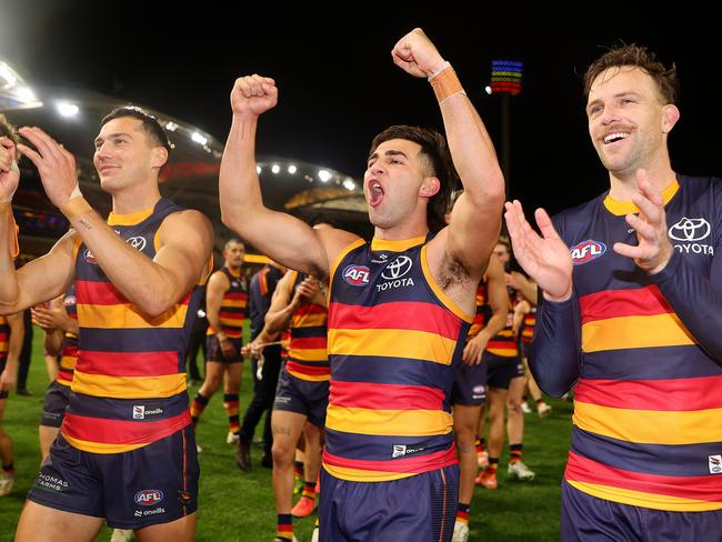 ADELAIDE, AUSTRALIA - JUNE 06: Josh Rachele of the Crows walks off with Brodie Smith of the Crows after the win during the 2025 AFL Round 13 match between the Adelaide Crows and the Brisbane Lions at Adelaide Oval on June 6, 2025 in Adelaide, Australia. (Photo by Sarah Reed/AFL Photos via Getty Images)