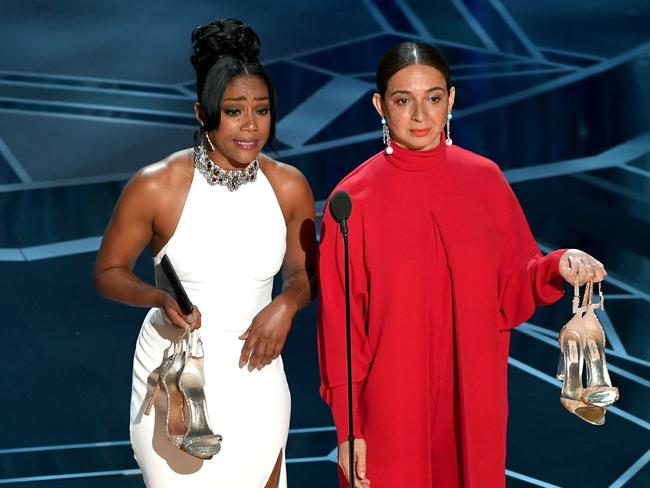 Haddish (L) and Maya Rudolph present at the Oscars — sans shoes. Picture: Getty