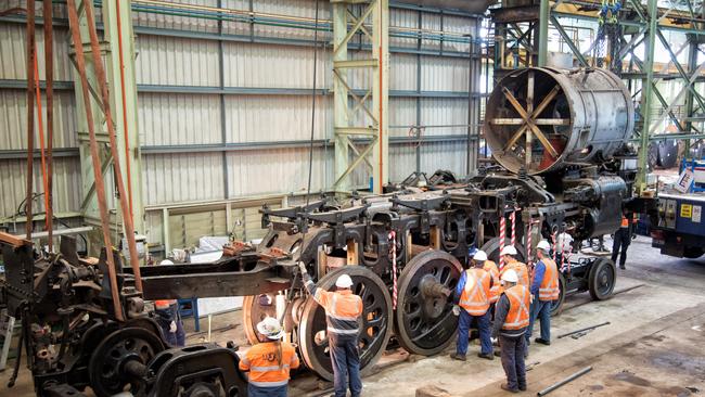 Workers restore the 3801 steam engine. Picture: Transport Heritage NSW