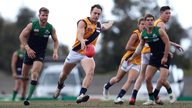 Adam Iacobucci of Strathmore runs the ball out of the centreduring the EDFL match between Greenvale and Strathmore played at Greenvale on Saturday 30th June, 2018.