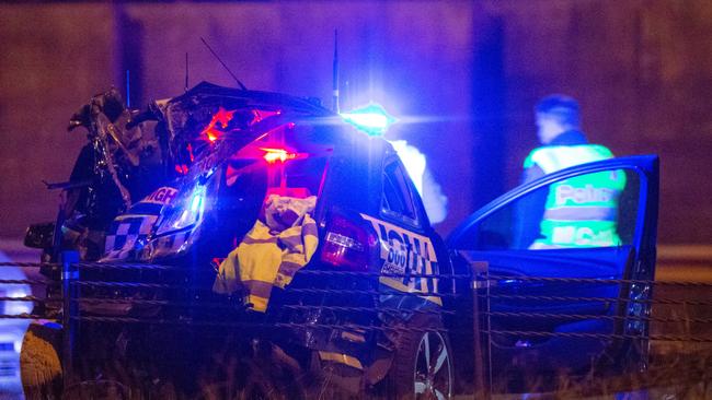 A badly damaged police car at the scene of the crash. Picture: Mark Stewart