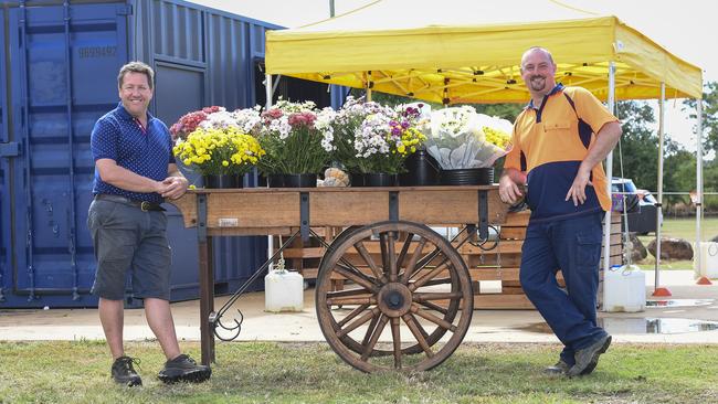 FLOWER POWER: Anthony Rehbein and Robert Campbell at the popup flower stall.