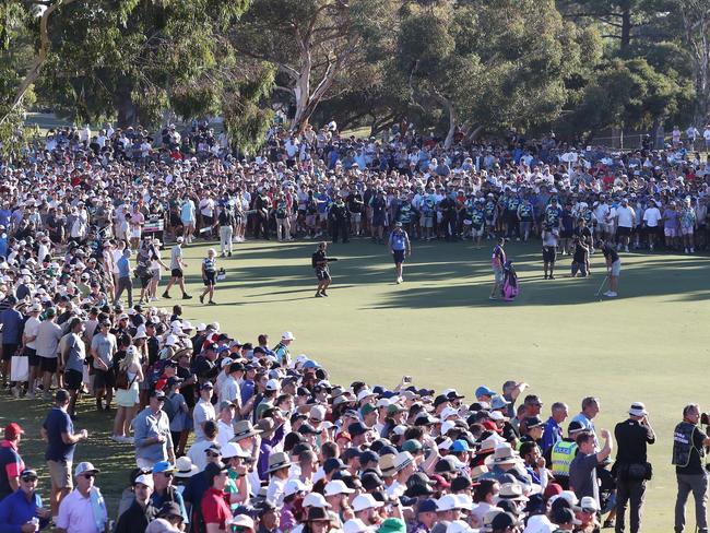 Talor Gooch on the 18th with the surging crowd during day three of Liv Golf Adelaide in 2023. The event is locked in for four more years. Picture: Getty Images