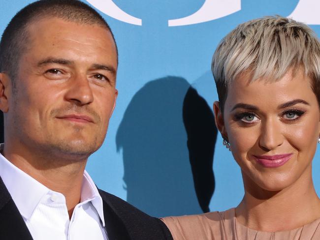 British actor Orlando Bloom (L) and US singer Katy Perry pose upon their arrival at the 2nd Monte-Carlo Gala for the Global Ocean 2018 held in Monaco on September 26, 2018. - On September 26, 2018, the Prince Albert II of Monaco Foundation will hold its second Monte-Carlo Gala for the Global Ocean, a major fundraising event in the heart of Monte Carlo, in order to support its worldwide initiatives in favor of a sustainable ocean, a crucial issue calling for immediate and collective action. (Photo by Valery HACHE / AFP)