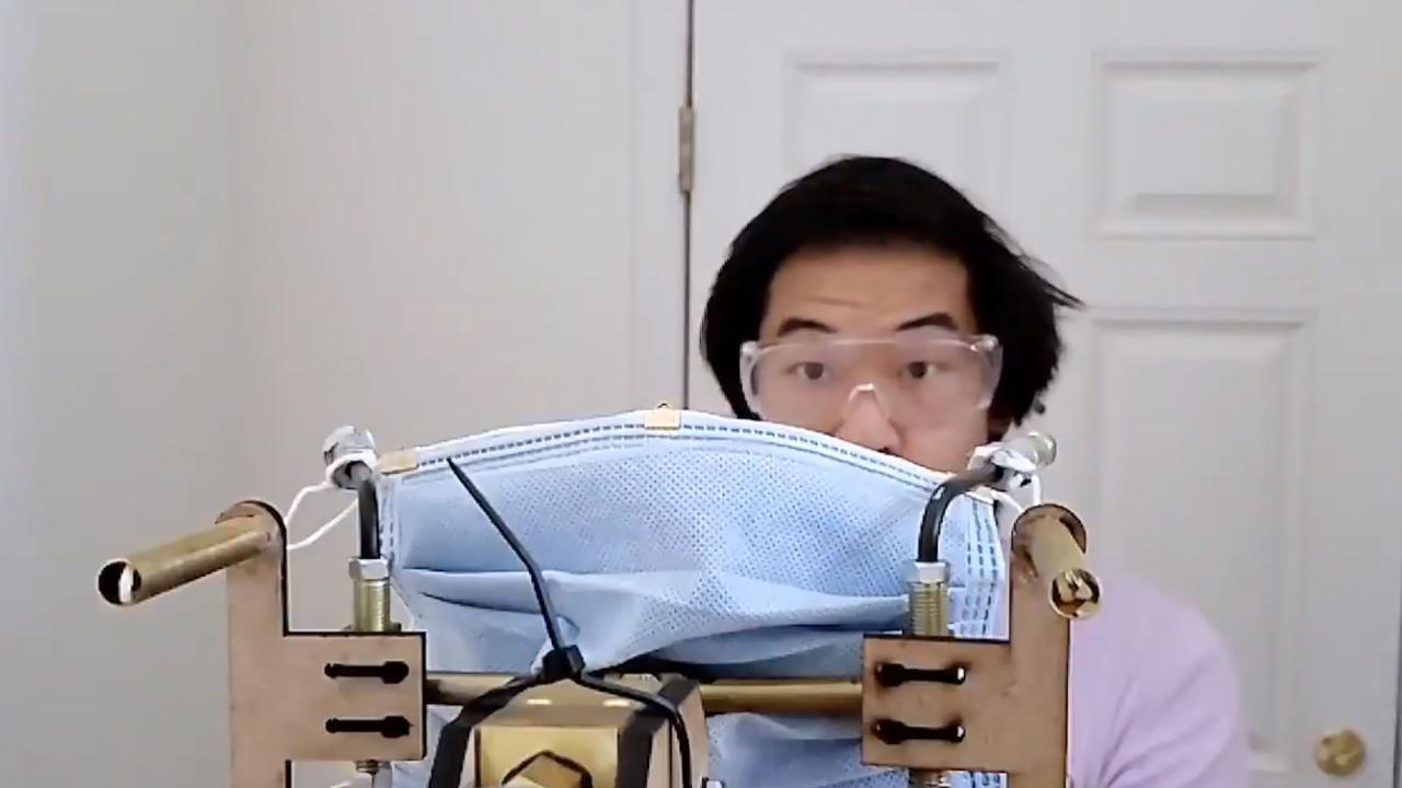 YouTuber Allen Pan prepares to turn the mask gun on himself. Picture: Allen Pan