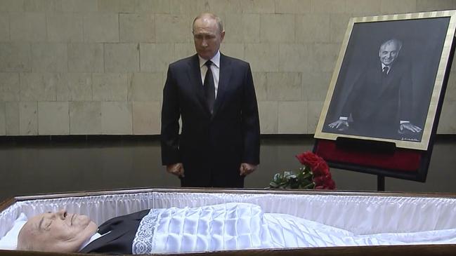 Russian President Vladimir Putin gazes upon the coffin of former Soviet President Mikhail Gorbachev at the Central Clinical Hospital in Moscow Russia. (Russian pool via Reuters)