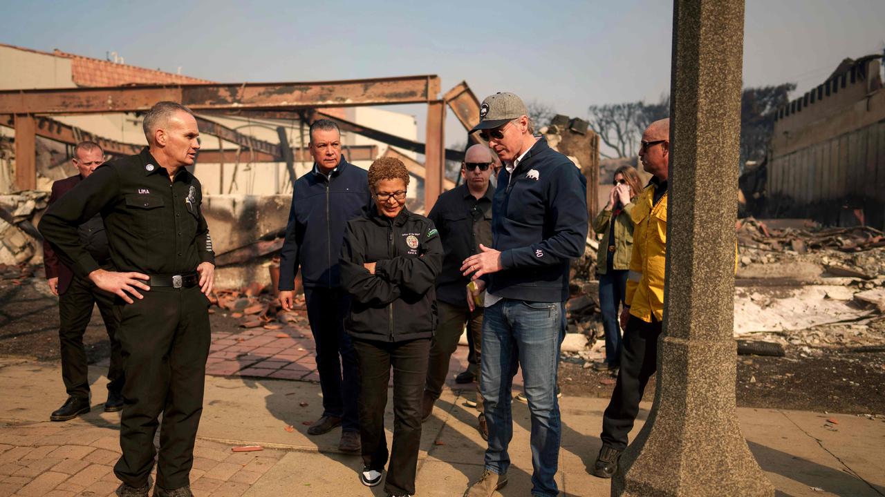 California Governor Gavin Newsom (R) and Los Angeles Mayor Karen Bass tour the downtown business district of Pacific Palisades as the Palisades Fire continues to burn.