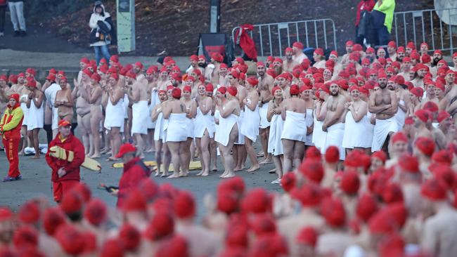 Or a very frosty dip, like participants of the nude solstice swim who brave the cold water at dawn at Long Beach, Sandy Bay. Picture: LUKE BOWDEN