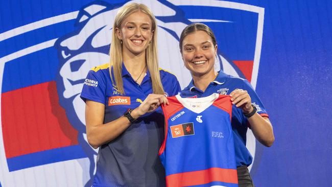 No. 1 AFLW Draft pick Kristie Lee Weston-Turner is presented her jumper by Ellie Blackburn. Picture: Wayne Taylor