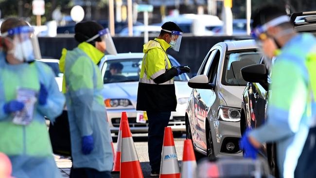 Health workers performing COVID-19 tests at the St Vincent's Drive Through testing clinic at Bondi on Saturday. Picture: NCA NewsWire/Bianca De Marchi