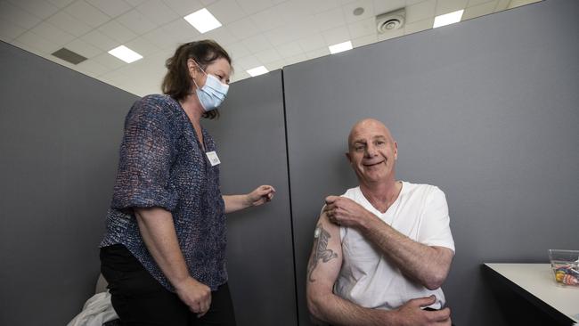 Tasmanian Premier Peter Gutwein at vaccination centre in Bridgewater speaking with bothwell couple Judith and Richard Bowden and later getting his jab from nurse, Leah.